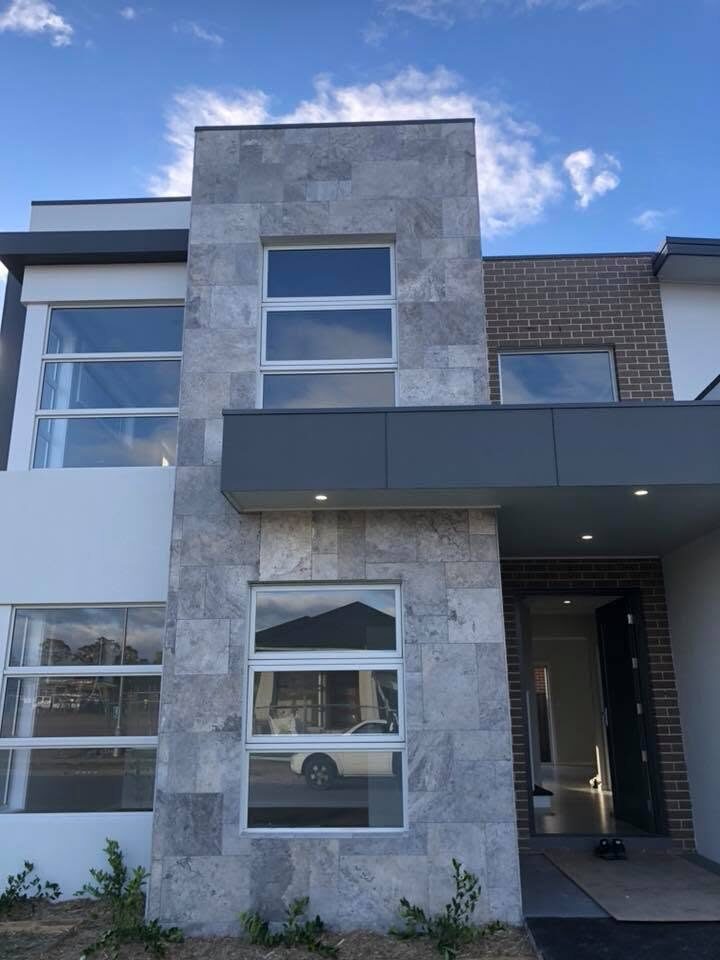 Modern two-storey facade, Stone tile and white, by Luxe Effects
